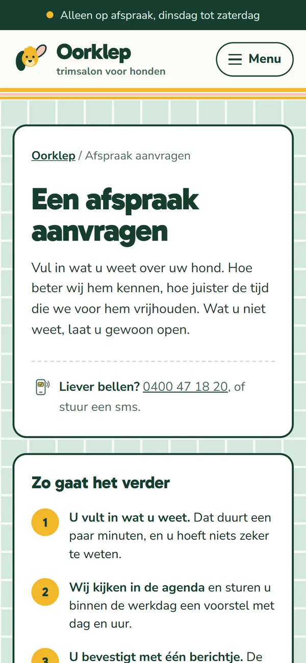 Een afspraak aanvragen in de website voor een hondentrimsalon, het begin van de pagina op een gsm